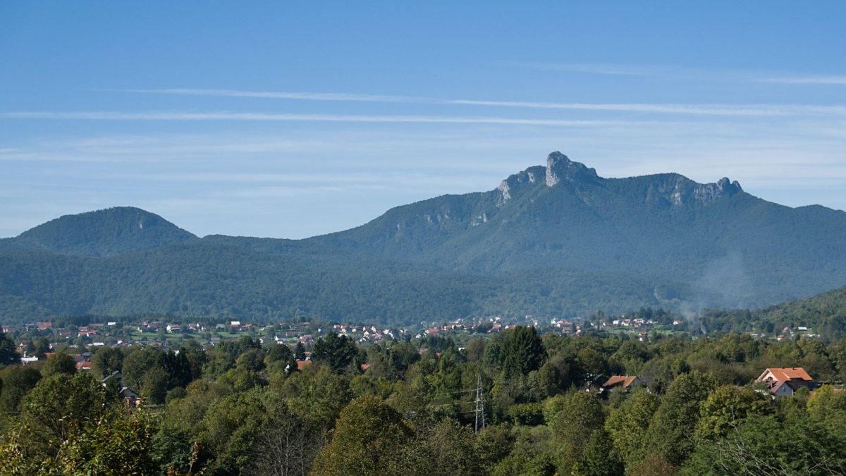 View from the ascent out of Ogulin. In the distance, the town of Ogulin and the peak of Klek.